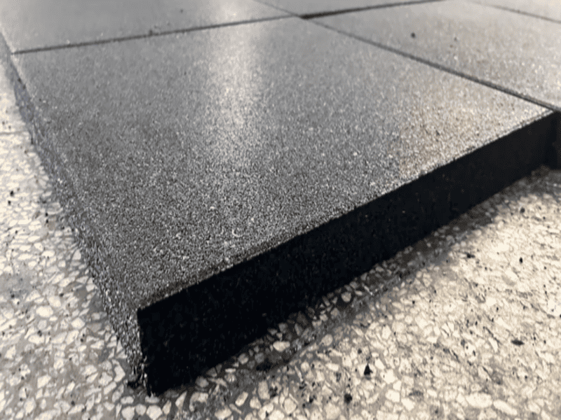 Close-up comparison of rubber wax bloom versus a clean vulcanized rubber surface texture